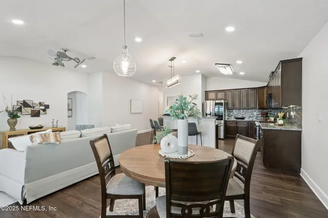 a view of a dining room with furniture