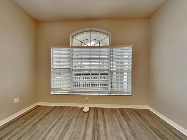 en empty room with closet and wooden floor