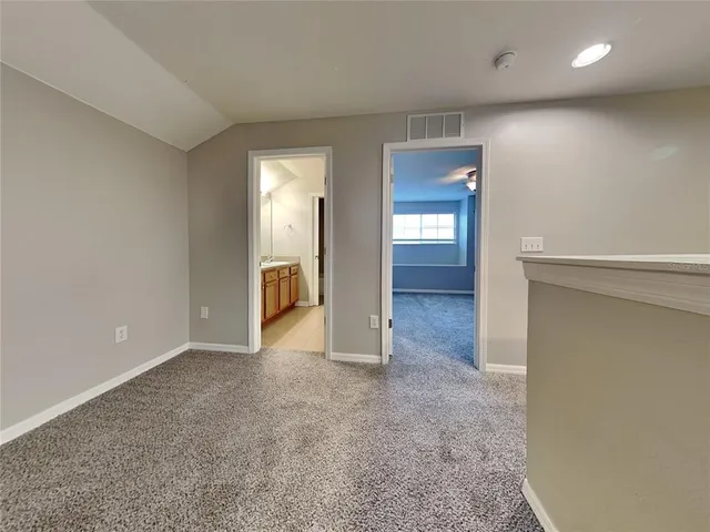 a view of a backyard with a patio and fire pit