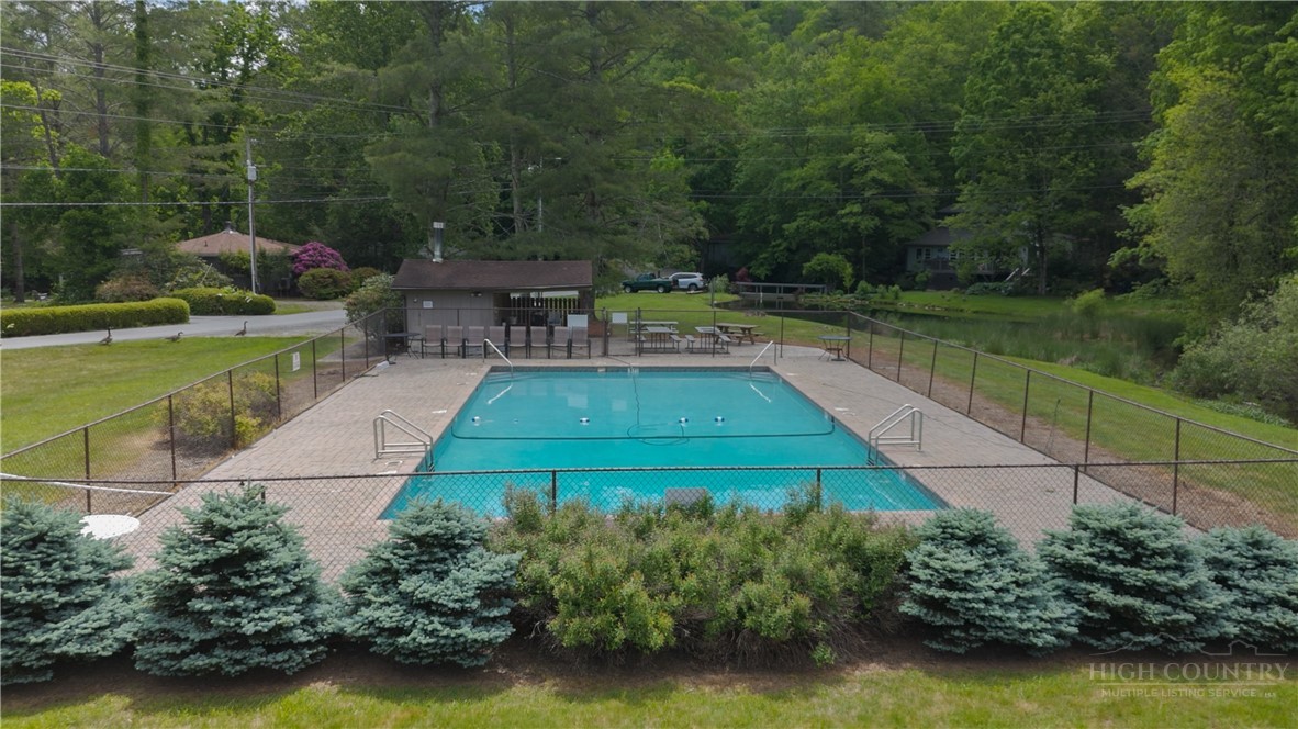 141 Snowflake Road Banner Elk, NC 28604 - Photo 28 of 28 a view of a swimming pool with a patio