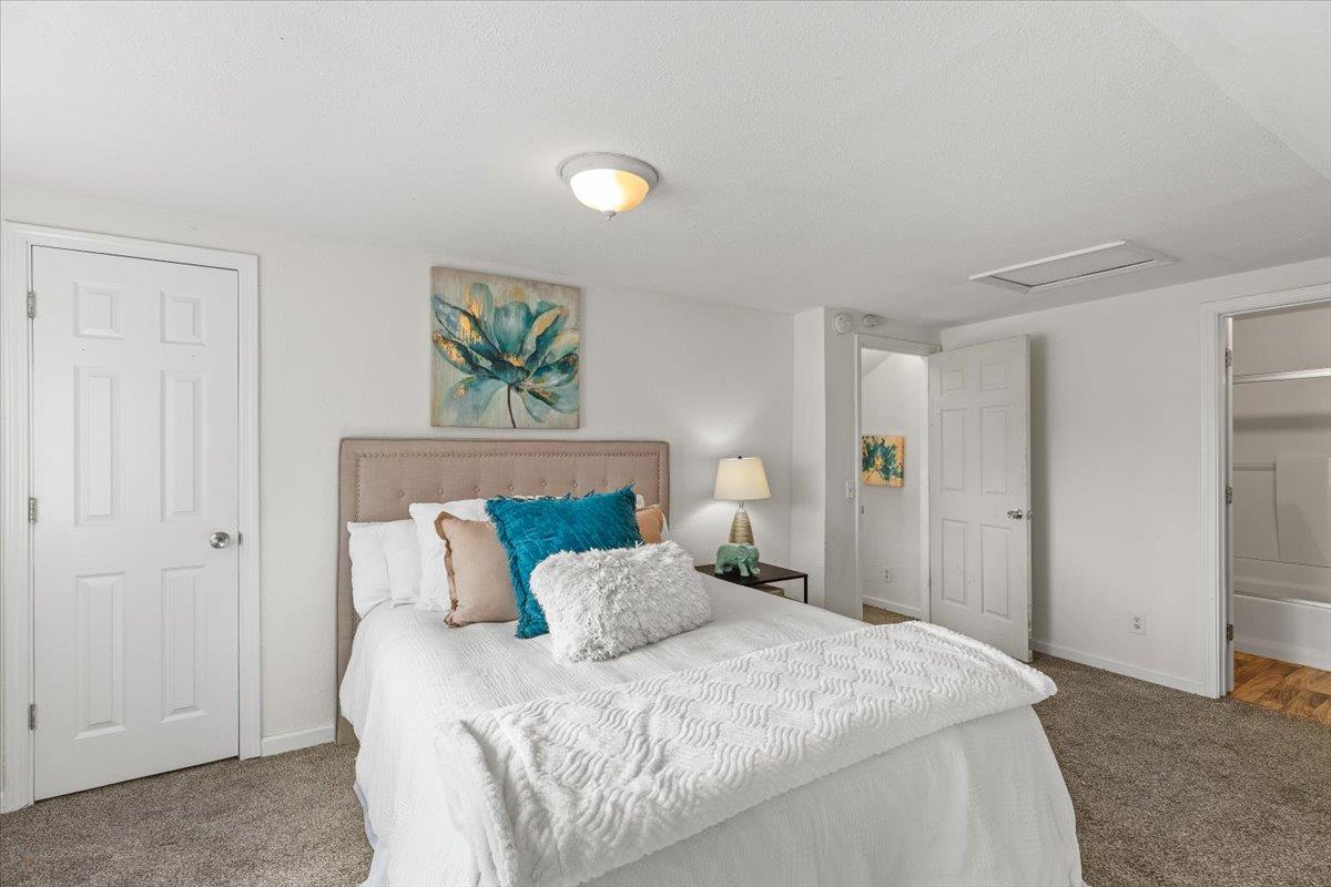572 Pedersen Road Oakdale, CA 95361 - Photo 28 of 36 a bedroom with a bed and a painting on the wall
