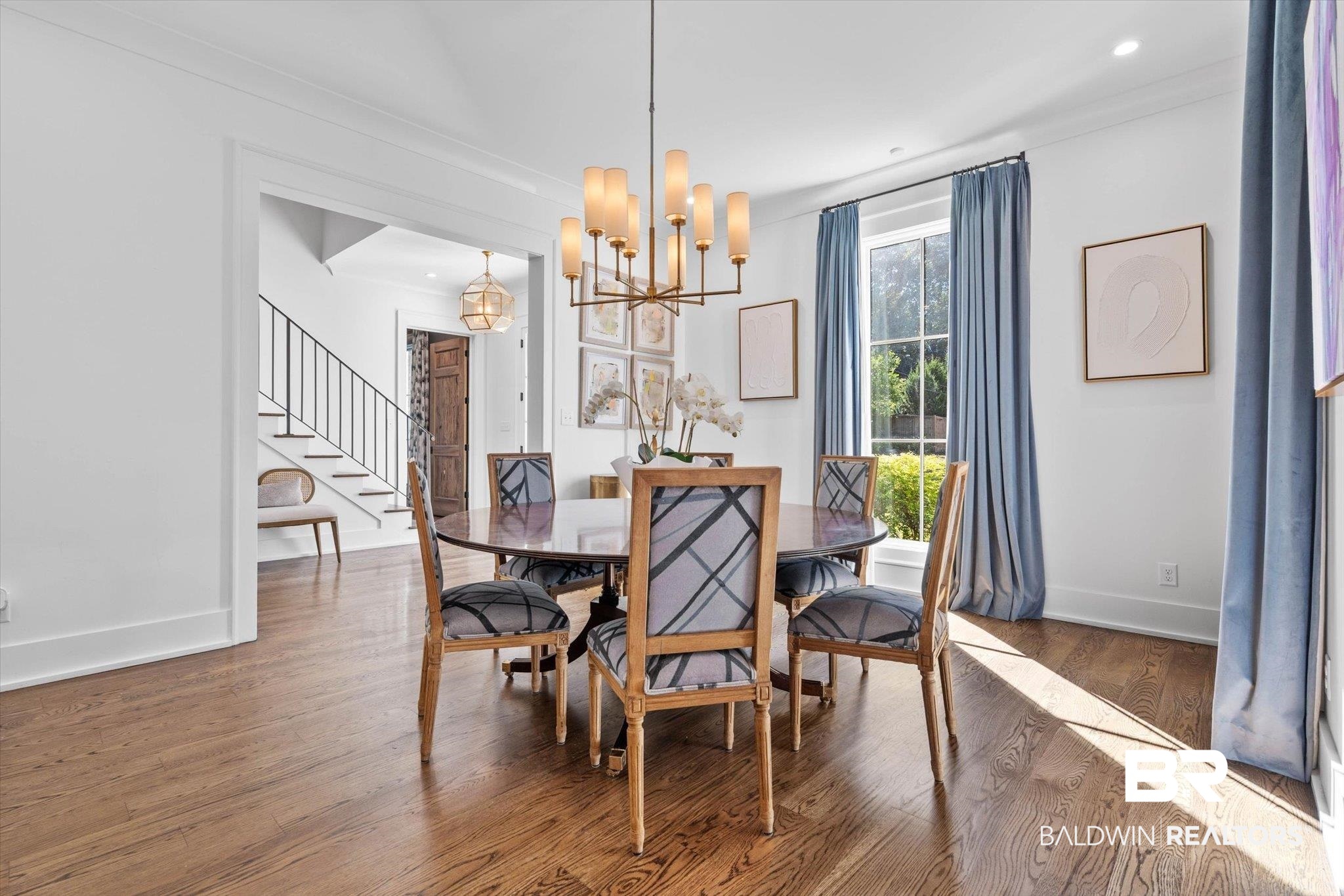 4602 Kingswood Drive Mobile, AL 36608 - Photo 5 of 45 Dining space featuring wood finished floors, stairway, a chandelier, and recessed lighting