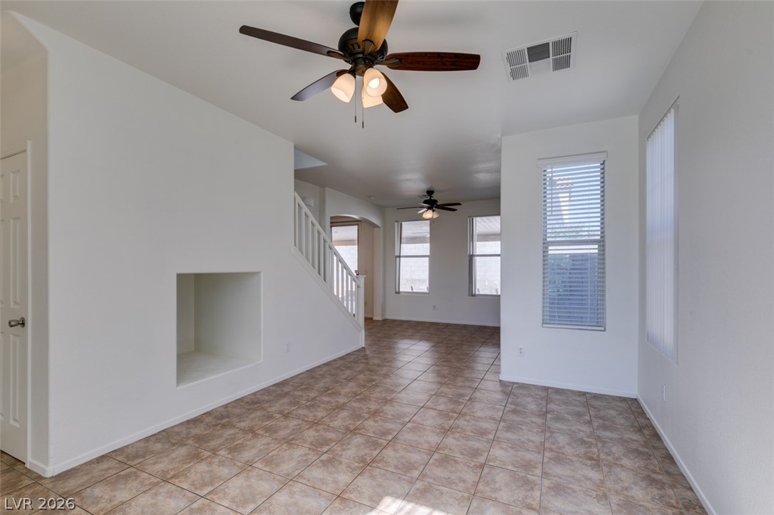 4957 Miners Ridge Drive Las Vegas, NV 89122 - Photo 11 of 39 This bright, inviting living area features durable tile flooring and abundant natural light.