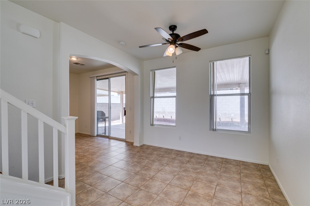 4957 Miners Ridge Drive Las Vegas, NV 89122 - Photo 13 of 39 This bright living space features durable tile flooring, providing a welcoming and practical environment.