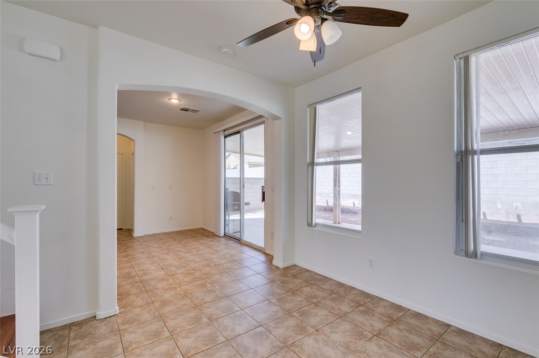 4957 Miners Ridge Drive Las Vegas, NV 89122 - Photo 14 of 39 This bright room features durable tile flooring, providing a versatile space for everyday living.