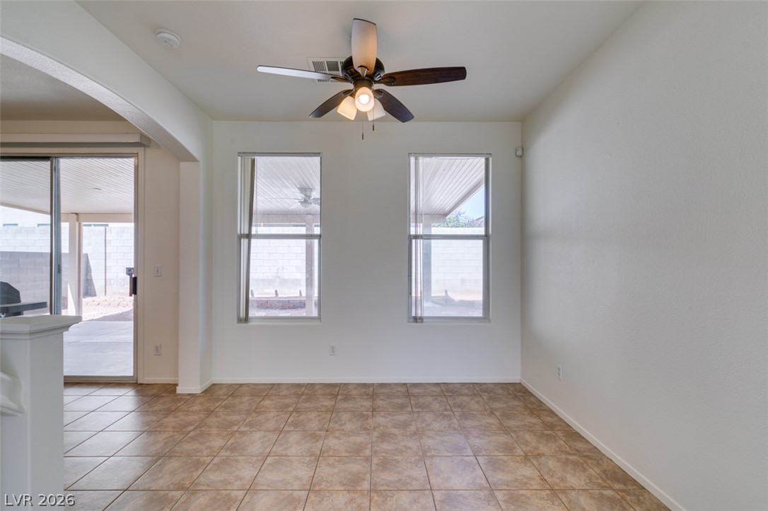4957 Miners Ridge Drive Las Vegas, NV 89122 - Photo 15 of 39 Bright and airy living space featuring durable tile flooring and abundant natural light.