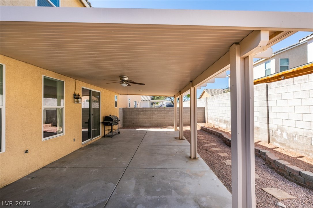 4957 Miners Ridge Drive Las Vegas, NV 89122 - Photo 36 of 39 Enjoy outdoor living with a spacious covered patio, ideal for entertaining and relaxation.