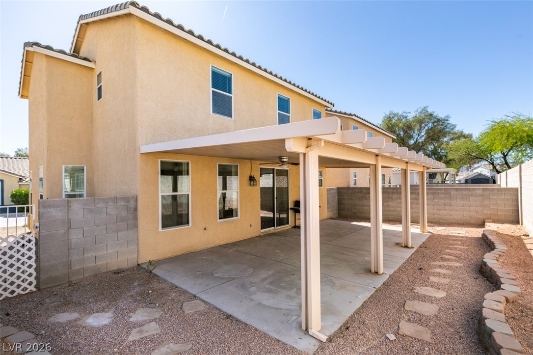 4957 Miners Ridge Drive Las Vegas, NV 89122 - Photo 37 of 39 This two-story residence features an expansive covered patio, ideal for outdoor entertaining and relaxation.