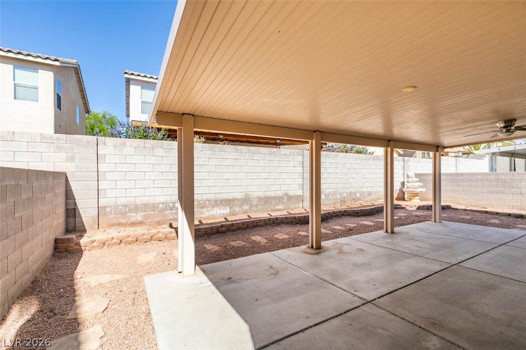 4957 Miners Ridge Drive Las Vegas, NV 89122 - Photo 38 of 39 This spacious patio area offers a perfect setting for outdoor relaxation and entertainment.