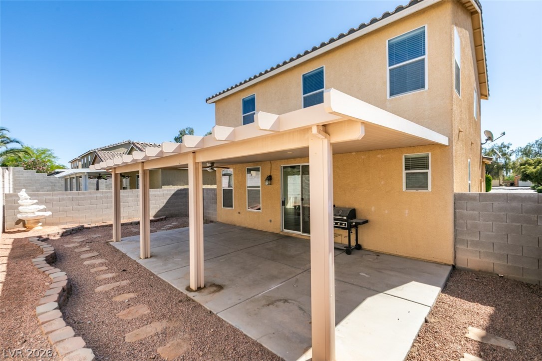 4957 Miners Ridge Drive Las Vegas, NV 89122 - Photo 39 of 39 This spacious backyard features a covered patio perfect for outdoor enjoyment and entertaining.