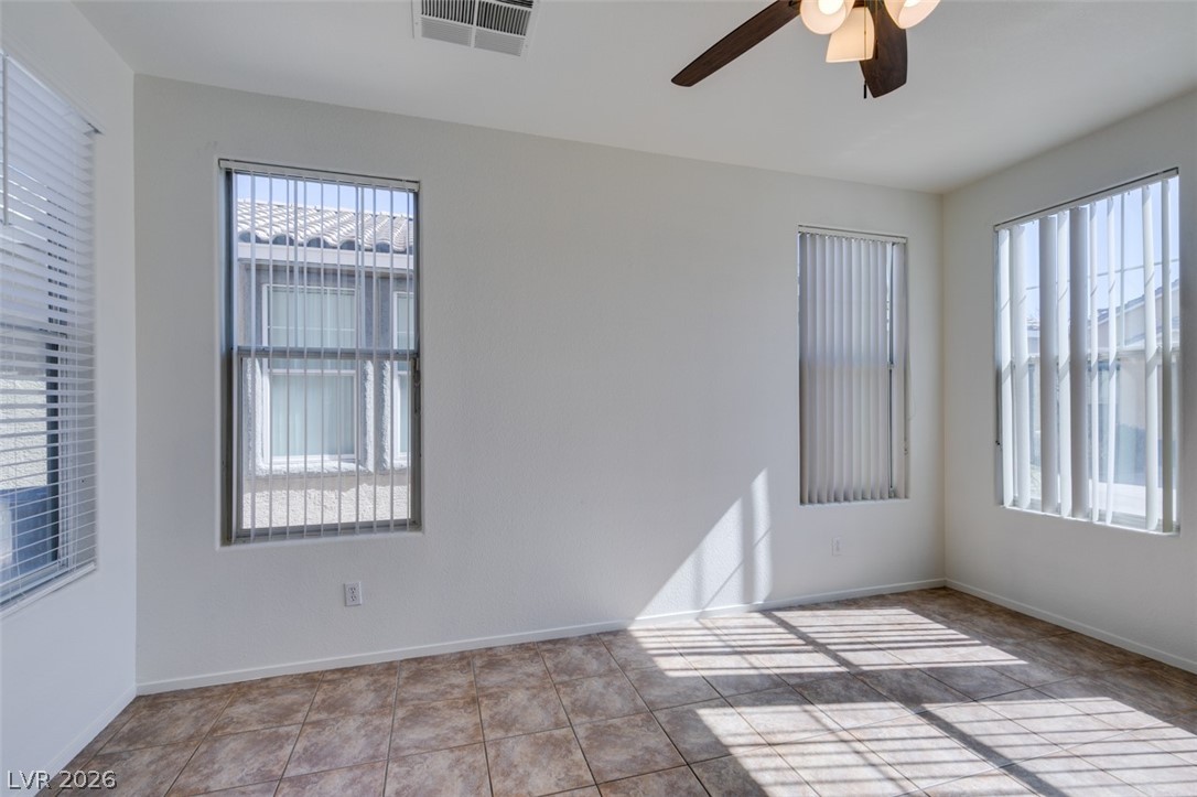 4957 Miners Ridge Drive Las Vegas, NV 89122 - Photo 6 of 39 Bright and airy room with tiled flooring and ample natural light.