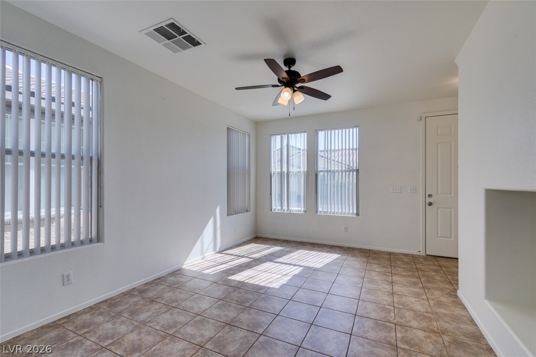 4957 Miners Ridge Drive Las Vegas, NV 89122 - Photo 7 of 39 Bright and airy living space featuring abundant natural light and practical finishes.