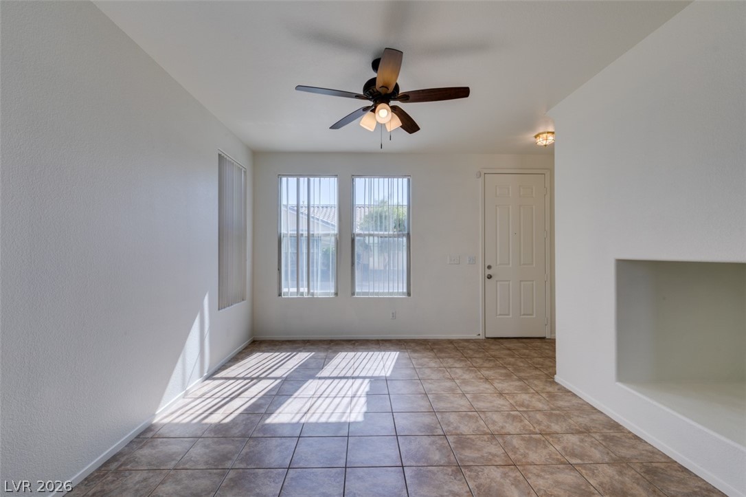 4957 Miners Ridge Drive Las Vegas, NV 89122 - Photo 8 of 39 Bright and open living space with tiled floors and abundant natural light.