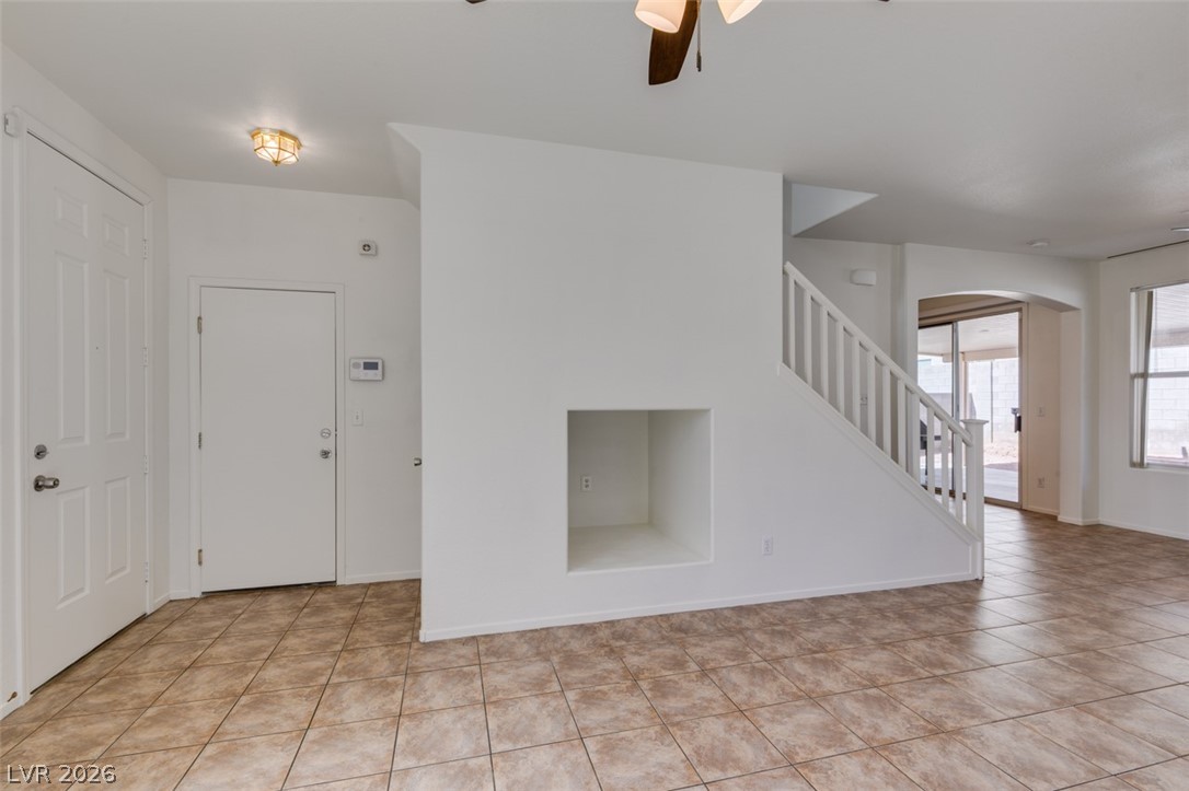 4957 Miners Ridge Drive Las Vegas, NV 89122 - Photo 10 of 39 This bright interior space features durable tile flooring, providing a clean and inviting atmosphere.