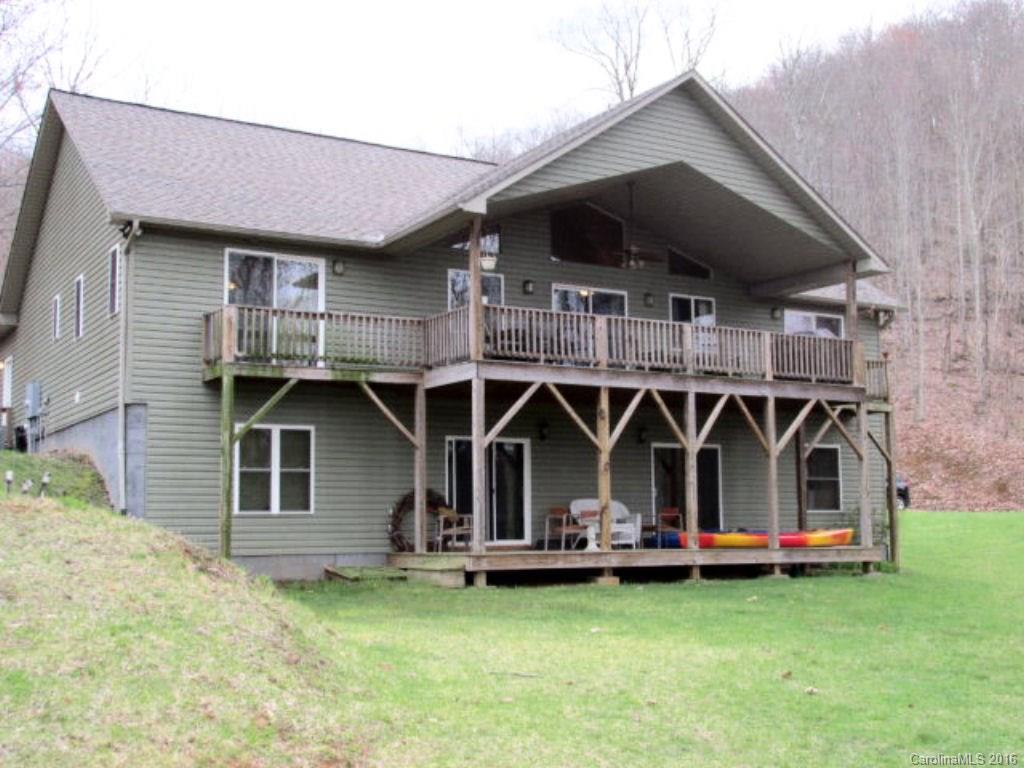 a front view of house with yard and trampoline