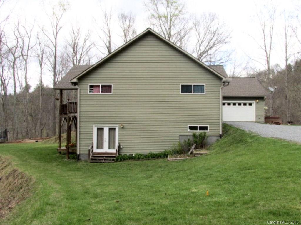 2574 Cabin Flats Road Sylva, NC 28779 - Photo 3 of 22 a backyard of a house with lots of green space