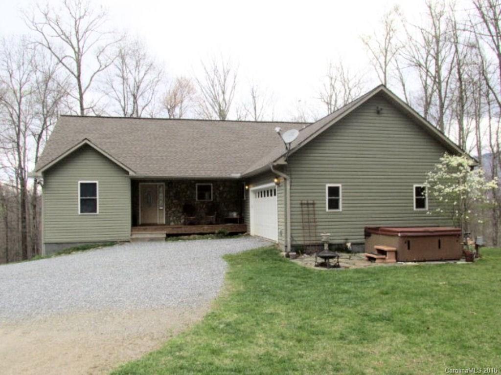 2574 Cabin Flats Road Sylva, NC 28779 - Photo 4 of 22 a front view of house with yard and trees in the background