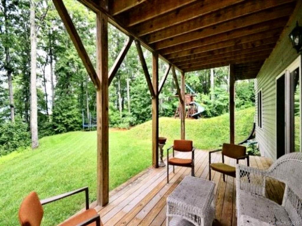 2574 Cabin Flats Road Sylva, NC 28779 - Photo 5 of 22 a view of porch with furniture and garden