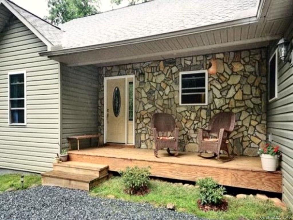 2574 Cabin Flats Road Sylva, NC 28779 - Photo 6 of 22 a front view of a house with a yard