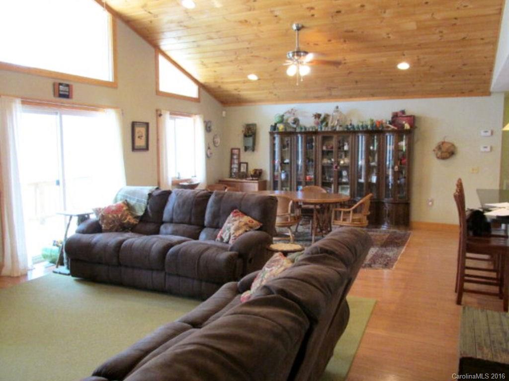 2574 Cabin Flats Road Sylva, NC 28779 - Photo 8 of 22 a living room with furniture and chandelier