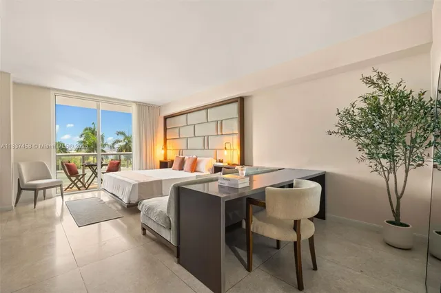 a view of a livingroom with furniture and a potted plant
