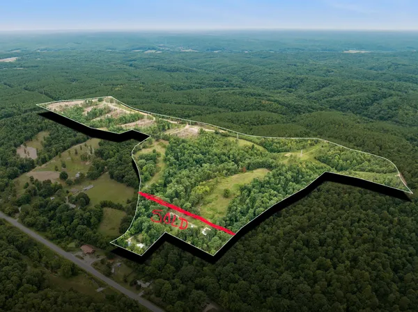 a view of a yard with an outdoor seating and deck