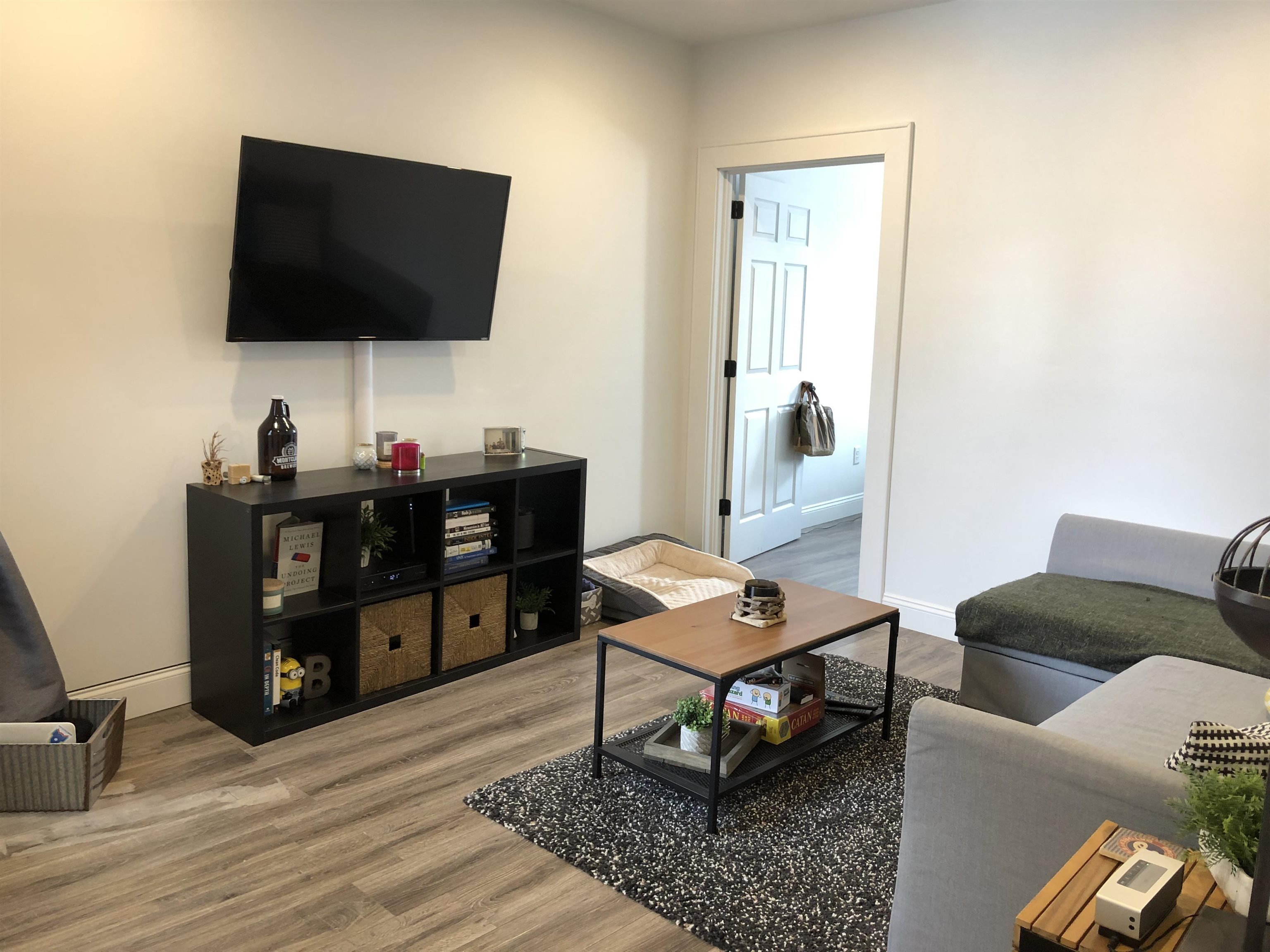 81 Glenridge Avenue, Unit 1 Montclair, NJ 07042 - Photo 2 of 9 a living room with furniture and a flat screen tv