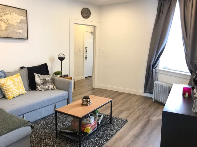 a living room with furniture and a window