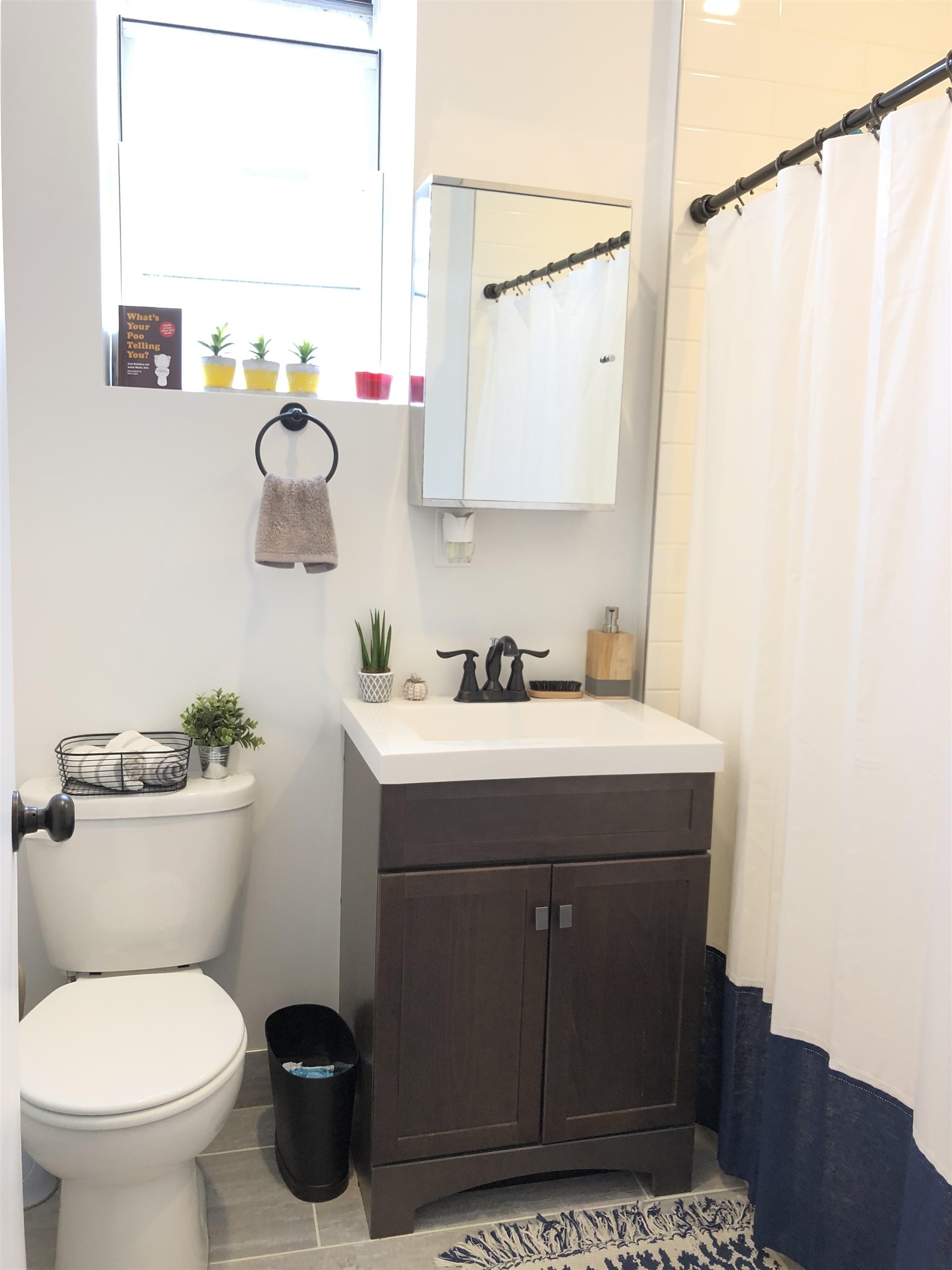 81 Glenridge Avenue, Unit 1 Montclair, NJ 07042 - Photo 8 of 9 a bathroom with a sink mirror vanity and toilet