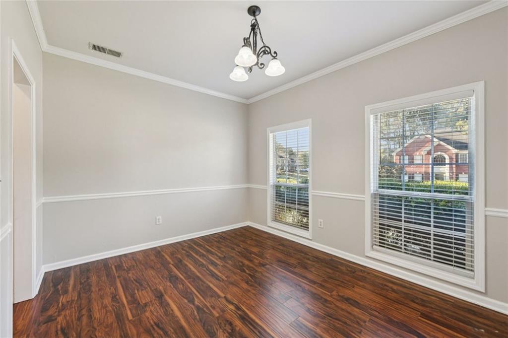 2435 Cobble Creek Lane Grayson, GA 30017 - Photo 17 of 39 wooden floor in an empty room with a window