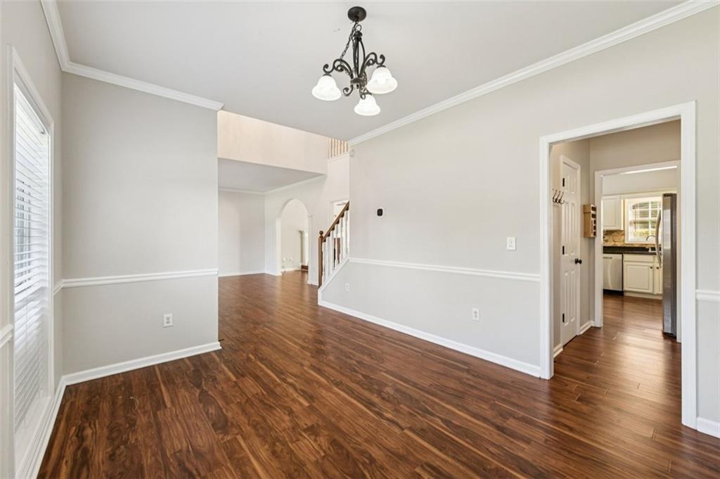 2435 Cobble Creek Lane Grayson, GA 30017 - Photo 18 of 39 a view of a hallway view with wooden floor and a living room