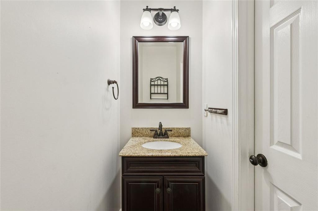 2435 Cobble Creek Lane Grayson, GA 30017 - Photo 26 of 39 a sink with a mirror