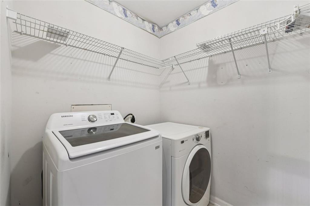 2435 Cobble Creek Lane Grayson, GA 30017 - Photo 37 of 39 a utility room with dryer and washer