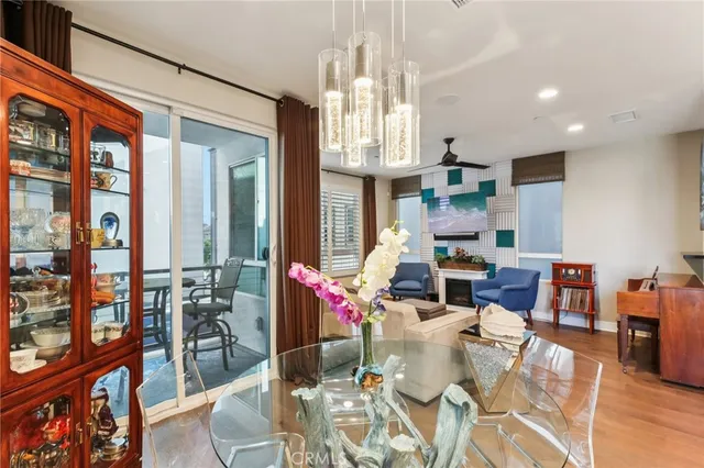 a living room with fireplace furniture and a chandelier
