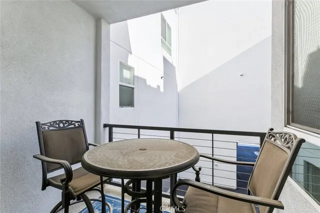 a view of a chair and table in a balcony