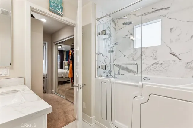 a bathroom with a shower and a sink