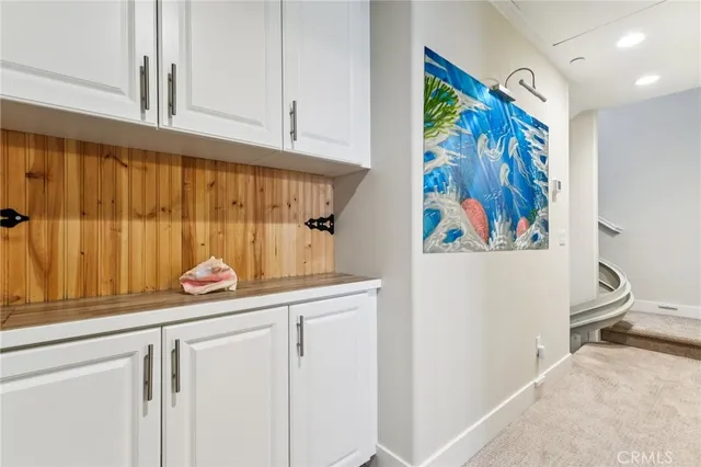 a view of a hallway with a painting on the wall