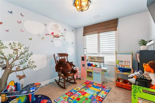 a view of a workspace with toys and a window
