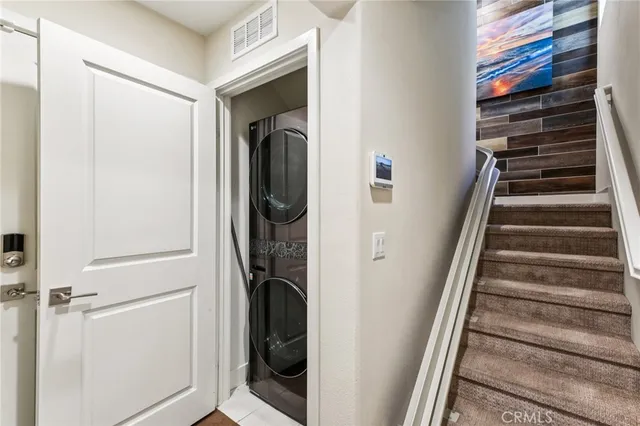 a kitchen with stainless steel appliances a stove and microwave
