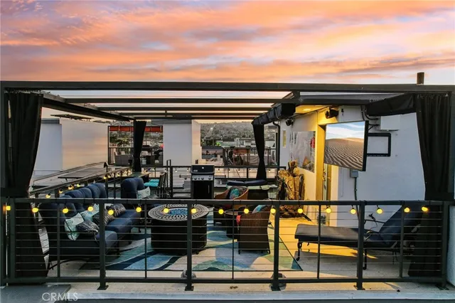 a front view of a house with lots of potted plants