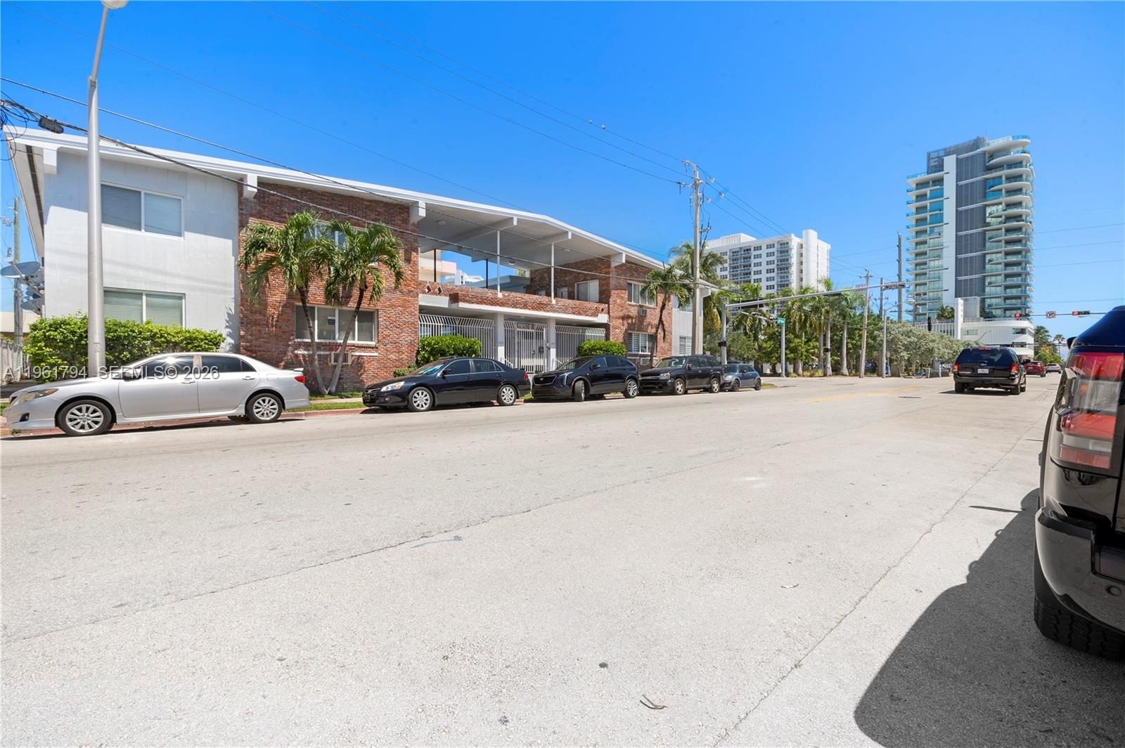 315 69th Street, Unit 112 Miami Beach, FL 33141 - Photo 1 of 20 a view of street with cars