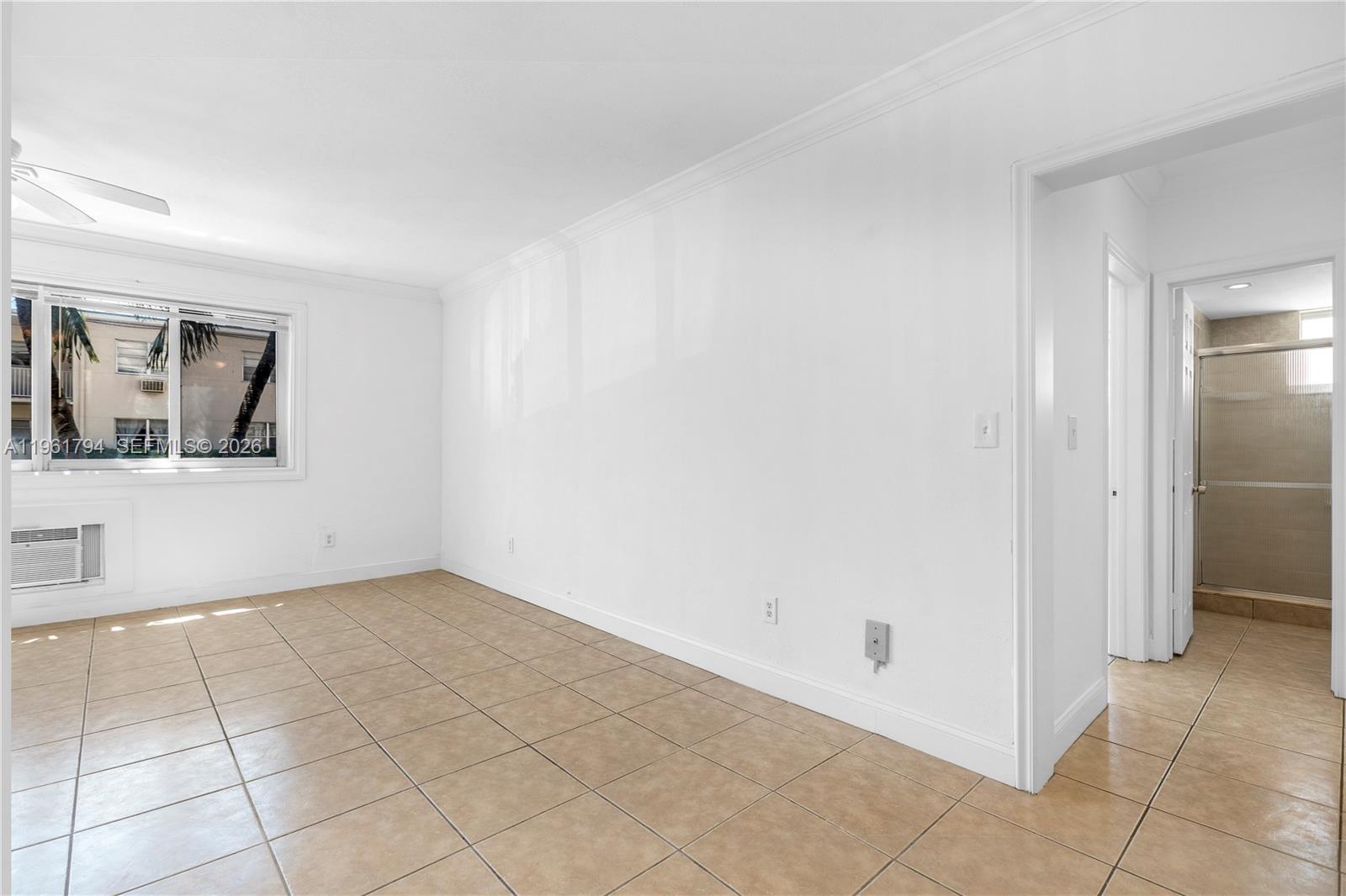 315 69th Street, Unit 112 Miami Beach, FL 33141 - Photo 12 of 20 an empty room with windows