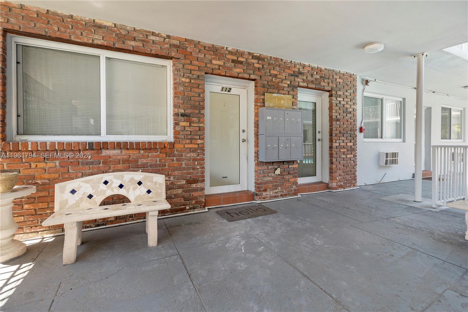 315 69th Street, Unit 112 Miami Beach, FL 33141 - Photo 20 of 20 a view of building with car parked