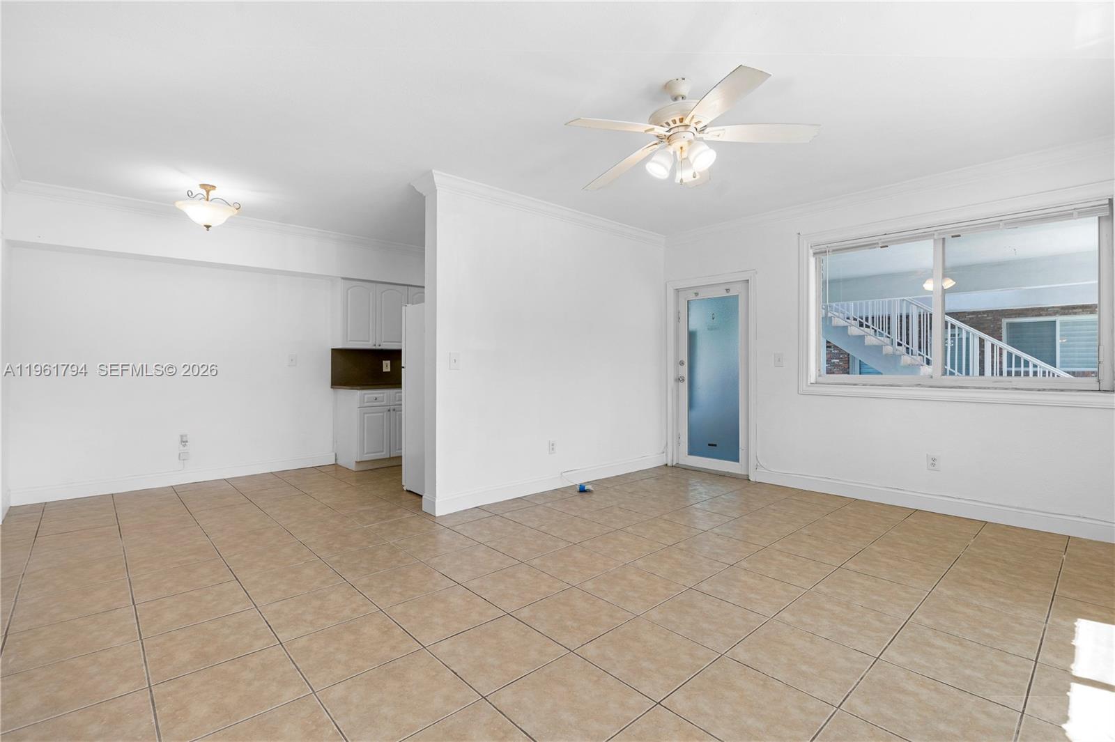 315 69th Street, Unit 112 Miami Beach, FL 33141 - Photo 5 of 20 a view of an empty room with a window