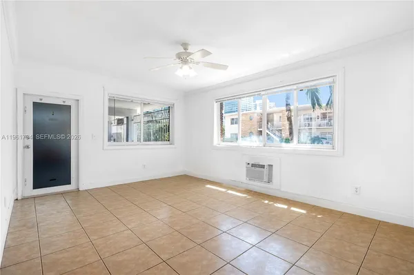 a view of an empty room with a window