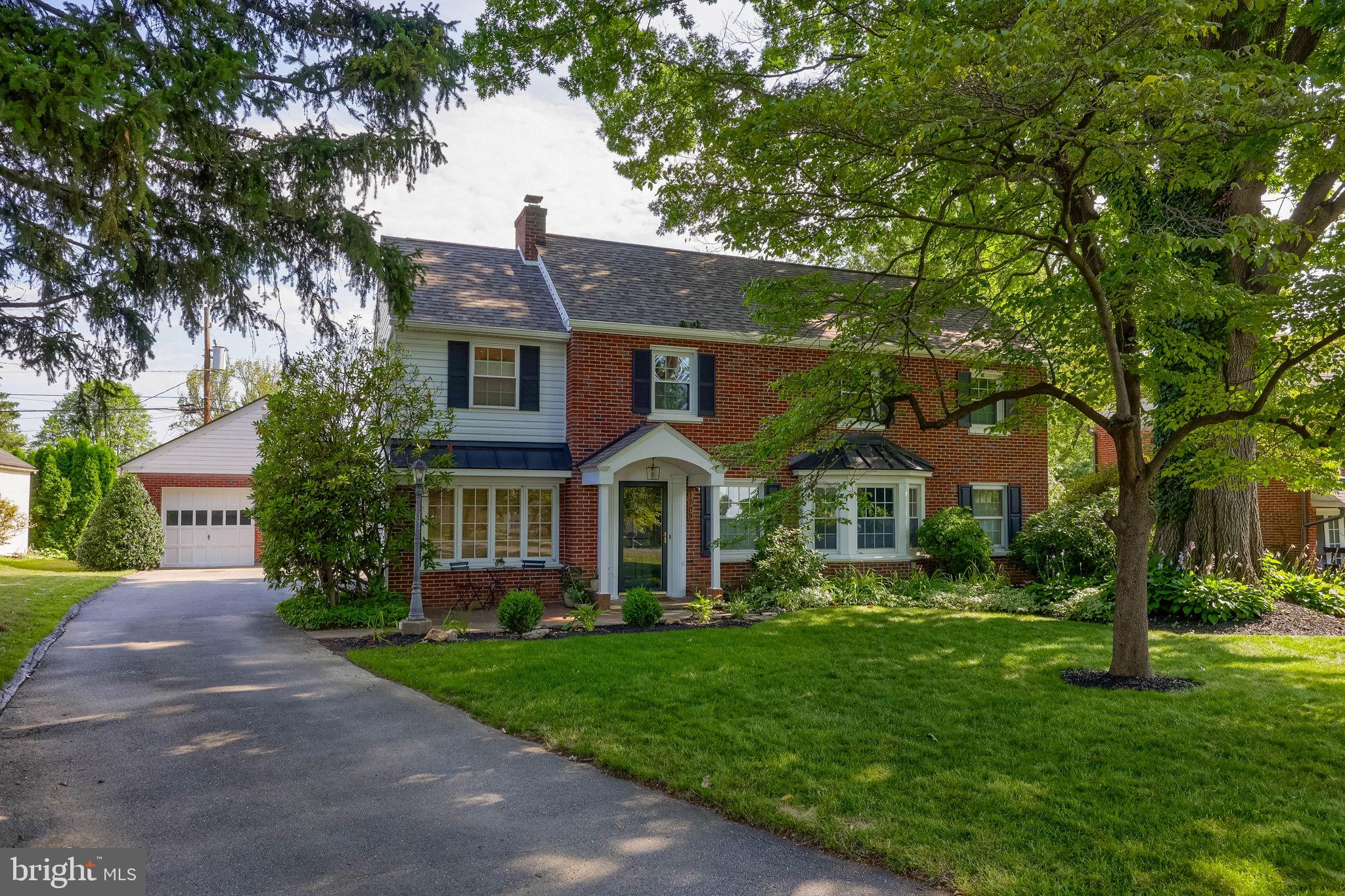 1709 Ridgeview Avenue Lancaster, PA 17603 - Photo 4 of 77 Charming brick home with lush greenery.