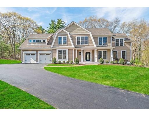84 Forest Avenue Cohasset, MA 02025 - Photo 1 of 30 a front view of residential houses with yard and green space