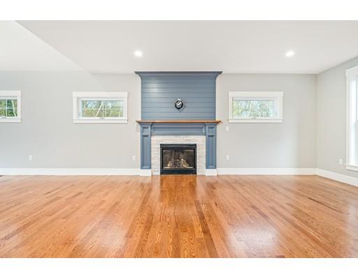 84 Forest Avenue Cohasset, MA 02025 - Photo 11 of 30 a view of an empty room with wooden floor fireplace and a window