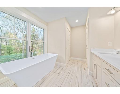 84 Forest Avenue Cohasset, MA 02025 - Photo 19 of 30 a bathroom with a sink and a large mirror