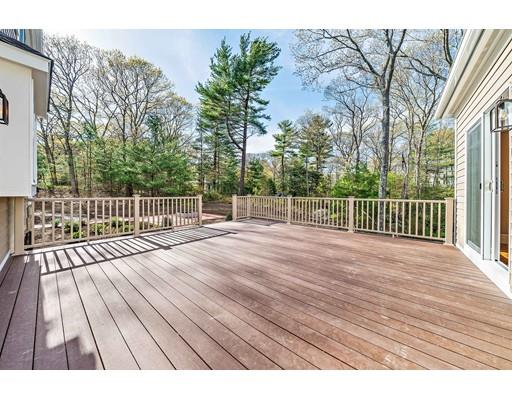 84 Forest Avenue Cohasset, MA 02025 - Photo 28 of 30 a view of a wooden deck and a yard